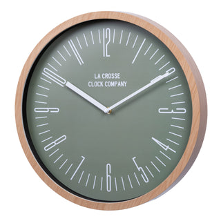 Left-facing image of the 404-3041D 16-inch Ellwood Wall Clock, featuring a flush-mount light wood frame, a sage green dial, modern white numbers, and white metal hour and minute hands.