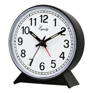 A black round desk clock with a white face, black numerals, and black hands, featuring a red second hand and the brand name 'Equity' printed on the dial. It is shown on a plain white background.