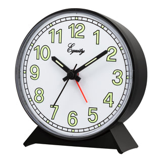 Left-facing image of the 14077 Quartz Analog Alarm Clock featuring a round black plastic frame and base with a white dial, green luminous numerals, black hour, minute, and second hands. The brand name 'Equity' is printed on the clock face.