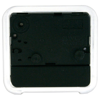 The back of a small square digital clock, showing the black internal mechanism and a clear outer protective plastic shell.