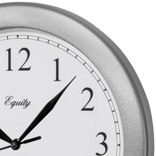 Close-up frame image of the 25206 10-inch Basics Wall Clock - Silver. The clock features a silver frame with a white dial, black numbers, and black metal hands.