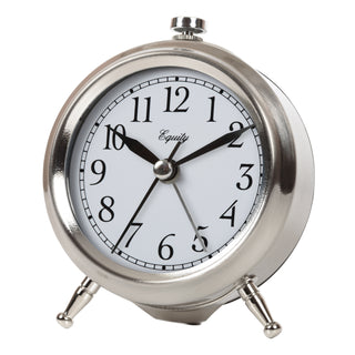 A classic round analog desk clock with a polished silver-tone metal body, black numerals, and black hands on a white face, shown against a plain white background.