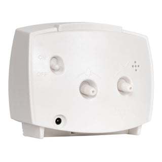 A back-angled image of the 33100 Electric Analog Alarm Clock. The rectangular-shaped alarm clock has a white case with a freestanding base, an on/off alarm switch, a knob to set the alarm time, a knob to set the time, and an AC power jack.