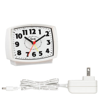 The 33100 Electric Analog Alarm Clock is displayed at a right angle with the AC 5-volt power cord not connected. The rectangular-shaped alarm clock has a white case with a freestanding base, a white clock face, black numbers and markings, black hour and minute hands, a red second hand, and a yellow alarm indicator.