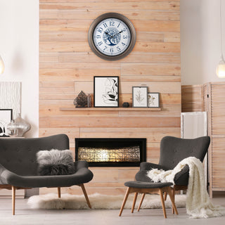 Modern decor living room with a faux fireplace with the  403--3246BR Lux light up indoor outdoor wall clock featuring a center image of a tree and Arabic numbers on a white and blue dial surrounded by a brown frame hanging above a shelf on a pine wood wall
