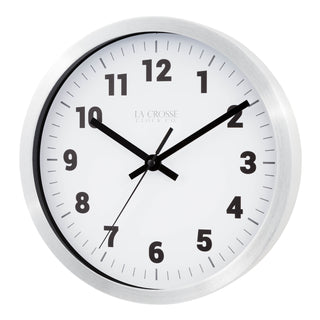 Left facing view of the Nash 404-2626 Wall Clock with a silver metal flush mount frame surrounding a white dial with black numbers, hour, minute and second hands and gray time markings