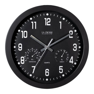 Head-on view of the 404-2631 12-inch Inkwell Wall Clock with a black flush mount frame surrounding a black dial with white numbers, thermometer that reads both Fahrenheit and Celsius and a Humidity gauge, featuring silver metal hour, minute, and second hands
