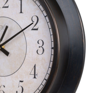 Close-up detail image of the frame of the 404-2636 14-inch Savannah Wall Clock featuring a parchement inspired dial with traditionally classic black numbers straight black metal hands, and an olied bronze decorative frame.
