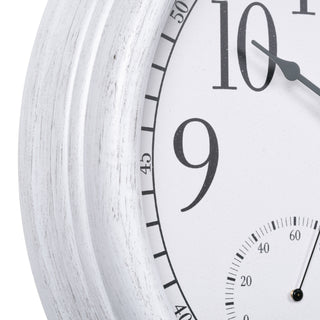 Close-up image of the frame detail of the 404-3015CC 15of a round wall clock showing part of the white face, black numerals, and a distressed white wood-look frame.