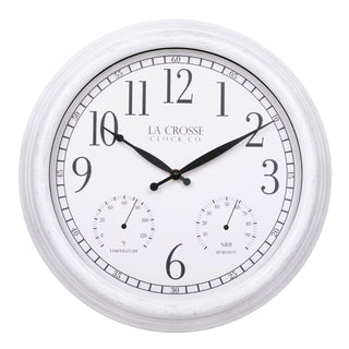 Head-on image of the 404-3015CC 15-inch Indoor/Outdoor Payton Wall Clock, the clock features a white distressed frame, a white dial with black Arabic numerals, black hands, and two small sub-dials for temperature and humidity. The brand name 'LA CROSSE CLOCK CO. is present below the number 12.