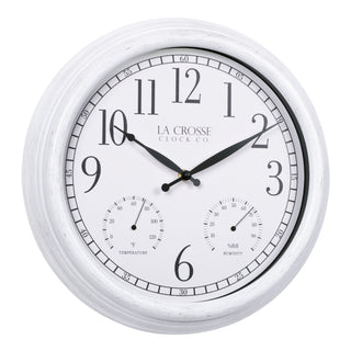 Right-facing image of the 404-3015CC 15-inch Indoor/Outdoor Payton Wall Clock, the clock features a white distressed frame, a white dial with black Arabic numerals, black hands, and two small sub-dials for temperature and humidity. The brand name 'LA CROSSE CLOCK CO. is present below the number 12.