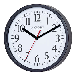 Left-facing image of the 404-3020B 8-inch Basics Analog Wall Clock – Black. The clock features a black flush-mount frame, a white dial with black numbers, black hour and minute hands, and a red second hand.