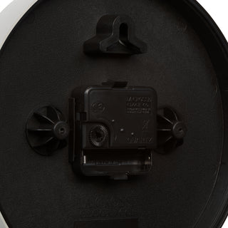 Close-up image of the back of the 404-3020S 8-inch Basics Analog Wall Clock – Silver showing the battery compartment, the quartz movement, and the hanging hole.