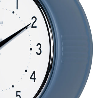 Close-up frame image of the 404-3024IB 9.5-inch Diner Clock – Indigo Blue features a retro-style Indigo Blue frame with a white dial, chrome bezel, black numbers and minute markings, black metal hands, and a silver second hand.