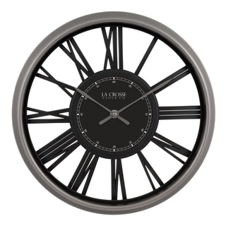 A round wall clock with a dark gray outer frame, black Roman numerals, and a black central dial featuring the brand name 'LA CROSSE CLOCK CO'.