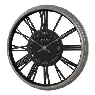 A La Crosse Clock Co. wall clock featuring a large circular frame with a dark gray outer rim and black spokes, surrounding a matching black dial with silver hands and Roman numerals.