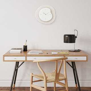 404-3039T Wooden desk with chair, clock, and lamp in a minimalistic room.