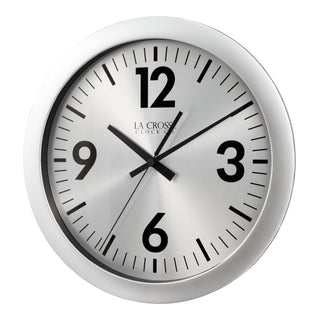 404-3229 A round wall clock with a brushed silver metal frame and a white dial featuring bold black Arabic numerals and hands. The brand name 'LA CROSS CLOCK CO.