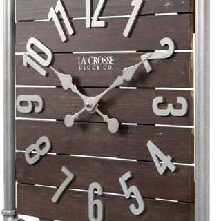 Close-up frame image of the 404-3412L 16-inch Foundry Metal & Wood Wall Clock - Light. The clock features a square metal pipe frame, stained wood slats, and metal pewter finish accents.
