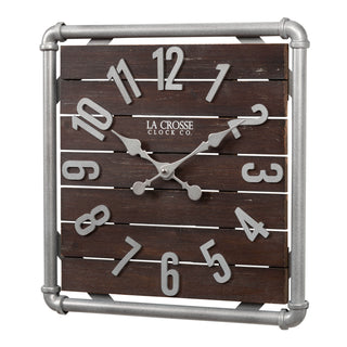 Left-facing image of the 404-3412L 16-inch Foundry Metal & Wood Wall Clock - Light. The clock features a square metal pipe frame in a weathered pewter finish, a truffle-brown-stained wood slat clock face with pewter-finished metal numbers and hands.