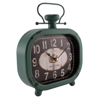 404-3425 A vintage-style metal alarm clock in distressed dark green with a round black face, large white numerals, and a small gold center detail, shown on a plain white background.