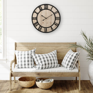 404-3450 Harper open face wall clock featuring a wood dial and laser cut black roman numerals and black metal hands in a farmhouse style entry way with a rustic bench baskets and a plant hanging on a white shiplap wall