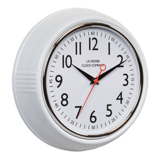 Right-facing image of the 404-3624W 9.5-inch Diner Clock – White. The clock features a retro-style white frame with a white dial, chrome bezel, black numbers and minute markings, black metal hands, and a red second hand.