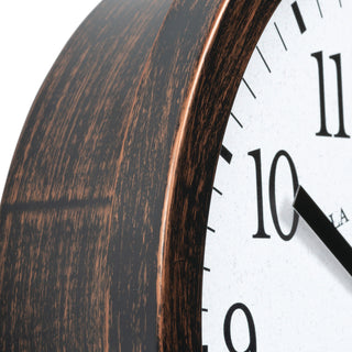 404-3825HC Close-up of a wall clock showing a dark brown wood-grain frame and a white face with black numerals.