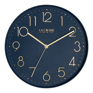Head-on image of the 404-3831NB 12-inch Paxton Wall Clock - Navy Blue, with Silent Sweep, featuring a flush-mount navy blue frame, a matching color dial, brass raised numbers, and brass-finished hour, minute, and second hands.