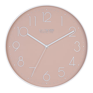 Head-on image of the 404-3831P 12-inch Paxton Wall Clock - Peach, with Silent Sweep, featuring a flush-mount peach frame, a matching color dial, white raised numbers, and white metal hour, minute, and second hands.