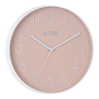 Right-facing image highlighting the buttons of the 404-3831P 12-inch Paxton Wall Clock - Peach, with Silent Sweep, featuring a flush-mount peach frame, a matching color dial, white raised numbers, and white metal hour, minute, and second hands.
