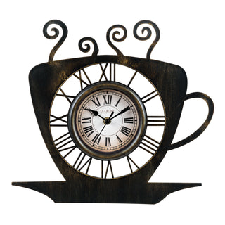 404-3833B A decorative wall clock shaped like a teacup, with a distressed dark brown and black finish, Roman numerals, and a central round clock face. The top of the cup features ornate curled handles, and the handle on the right extends outward.