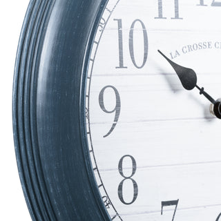 404-3841B Close-up of a clock with a white face and blue rim on a white background