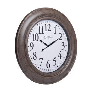 404-4292 A round wall clock with a distressed brown wood-look frame and a white clock face featuring black Arabic numerals and hands. The brand name 'LA CROSSE CLOCK CO.