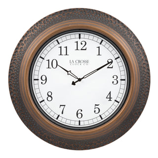 433-3256B A round wall clock with a textured bronze-brown frame and a white dial face featuring black Arabic numerals and black hands. The brand name 'LA CROSSE CLOCK CO.