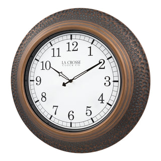 433-3256B A round wall clock with a textured bronze-brown outer frame, a white dial face, black Arabic numerals, and black hands. The brand name 'LA CROSSE CLOCK CO.