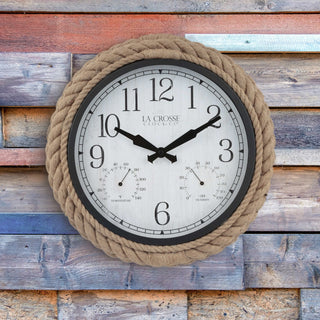 433-3836 A round wall clock with a thick natural rope border, a black outer rim, and a white dial featuring black Arabic numerals and dual sub-dials. The brand name 'LA CROSSE CLOCK CO.