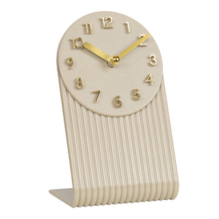 Right-facing image of the 437-3015SW Grooves Tabletop Clock. The clock features a molded soft white L-shape design with textured grooves, an open face dial, step motion quartz movement, and brass hands and numbers.