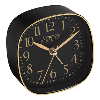 Right facing black square alarm clock with gold accents and black numbers.