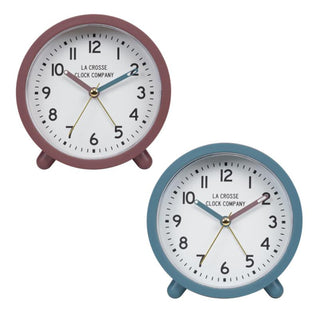Group image of the 617-3816COMBO Analog Quartz Alarm Clock. The image features the maroon alarm clock and teh blue alarm clock. The first alarm clock features a maroon case with matching hour hand and an accent blue minute hand, while the second alarm clock features a blue case with matching hour hand and an accent maroon minute hand. Both clocks feature a white dial with black numbers, a brass second hand, and a brass alarm indicator.