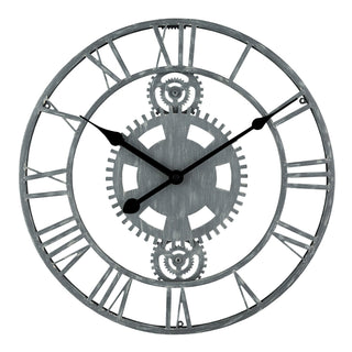 83186 A round metal wall clock with a distressed gray finish, featuring Roman numerals and central gear details, shown against a plain white background.