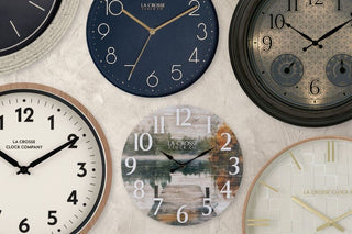Assortment of La Crosse Clock Co branded clocks in various styles.