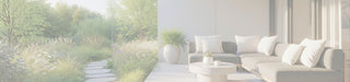 Modern outdoor patio seating area with a dark gray sectional sofa, white throw pillows, a round white coffee table, and a large potted plant, set beside a landscaped garden with a stone path and tall grasses.