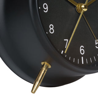 Close-up detail image of the feet of the W72449 Metal Twin Bell Alarm Clock – Black, showing the feet and black metal case.