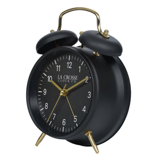 Left-facing image of the W72449 Metal Twin Bell Alarm Clock – Black, the clock features a black dial with white numbers, gold hands and accents, in a black metal case.